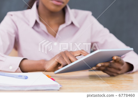Close up of a teacher using a tablet computer Close up of a teacher using a tablet computer 6778460