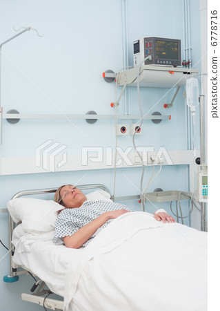 Female patient sleeping on a bed Female patient sleeping on a bed 6778716