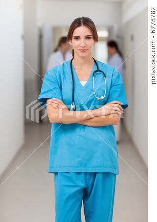 Nurse folding her arms while standing Nurse folding her arms while standing 6778782