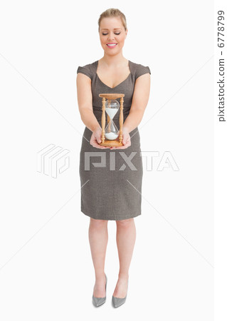 Woman holding a hourglass 6778799