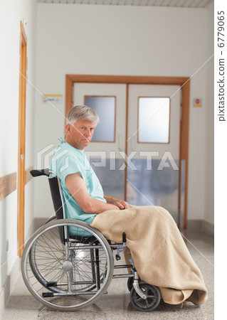 Patient sitting in a wheelchair with a blanket 6779065