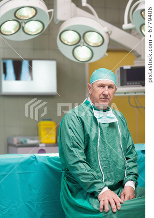 Serious surgeon looking at camera Serious surgeon looking at camera 6779406