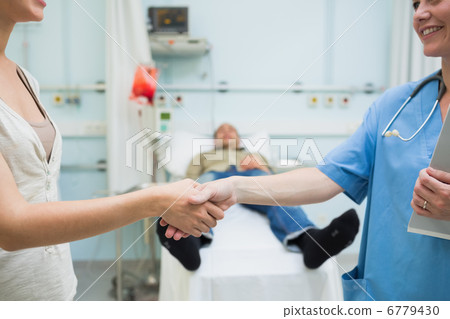 Nurse shaking hand of a patient Nurse shaking hand of a patient 6779430