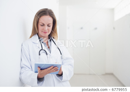 Doctor using an ebook Doctor using an ebook 6779955