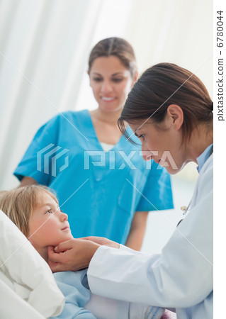 Doctor auscultating a child Doctor auscultating a child 6780044