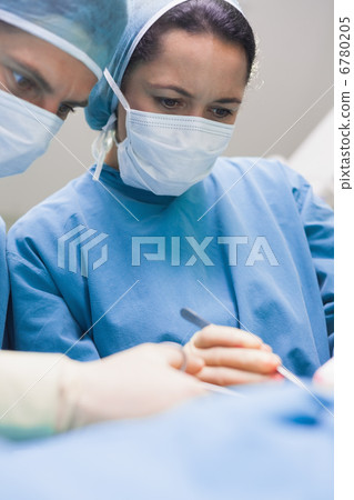 Doctor looking at a patient seriously Doctor looking at a patient seriously 6780205