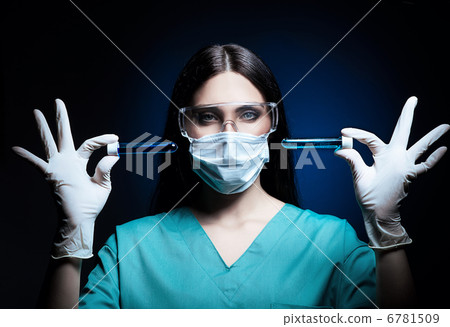 cute scientist and tubes with blue liquid in dark 6781509