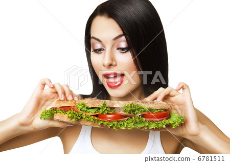 funny woman looking at long sandwich 6781511