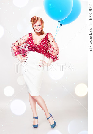 Happy smiling pin-up woman with blue balloons 6781922