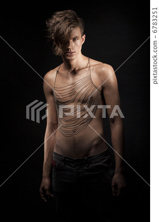 Ultramodern Stylish Young Man standing in Shadows. Romance Ultramodern Stylish Young Man standing in Shadows. Romance 6783251