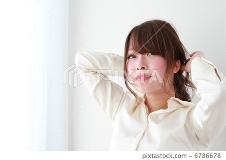 Business woman bundling hair 6786678