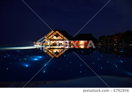 Night view of Maldives resort pool 6792856