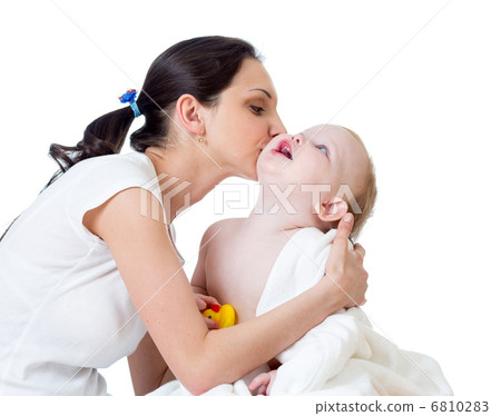 mother kissing baby after bathing 6810283