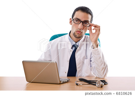 Male doctor working on laptop Male doctor working on laptop 6810626