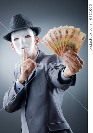 Businessman with money and mask 6811066