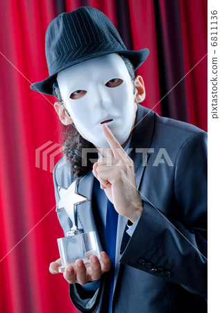 Man receiving award in mask 6811136