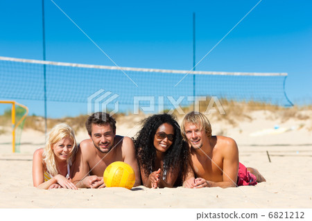 Friends playing beach volleyball 6821212