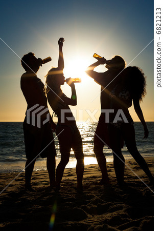 People having party at beach with drinks 6821213