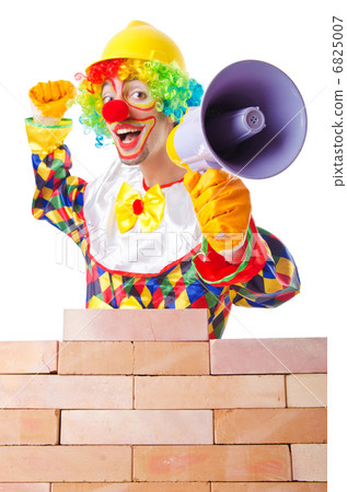 Bad construction concept with clown laying bricks Bad construction concept with clown laying bricks 6825007