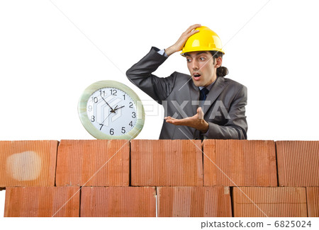 Businessman with bricks on white Businessman with bricks on white 6825024