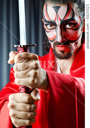 Man with face mask and sword Man with face mask and sword 6825025