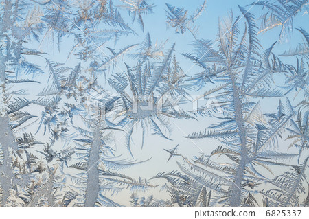 The abstract frosty pattern on glass The abstract frosty pattern on glass 6825337