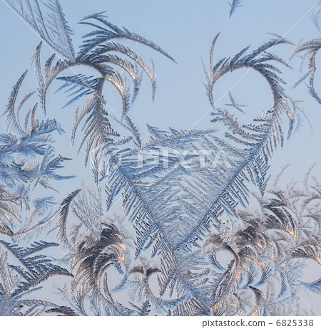 The abstract frosty pattern on glass The abstract frosty pattern on glass 6825338