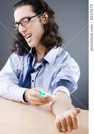 Young druc addict with syringe 6825679