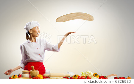 Asian female cook making pizza Asian female cook making pizza 6826983