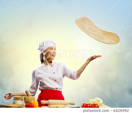 Asian female cook making pizza Asian female cook making pizza 6826992