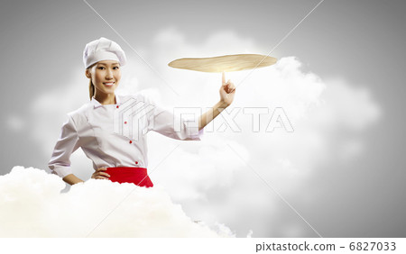 Asian female cook making pizza 6827033