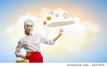 Asian female cook making pizza 6827034