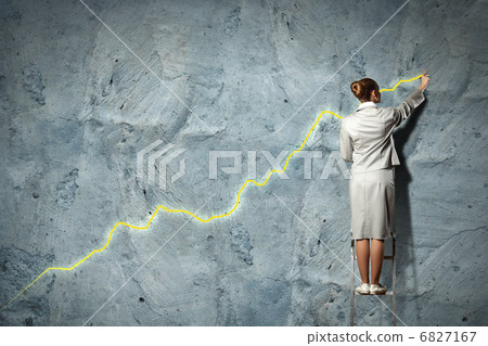 businesswoman drawing diagrams on wall 6827167