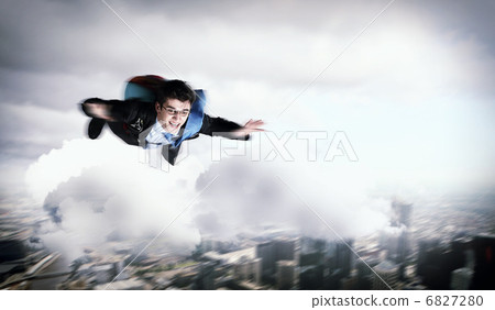 Young businessman flying with parachute on back 6827280