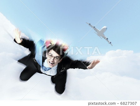 Young businessman flying with parachute on back Young businessman flying with parachute on back 6827307