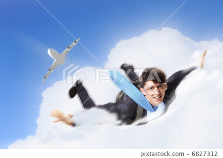 Young businessman flying with parachute on back 6827312
