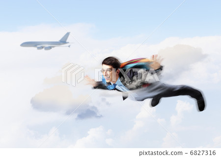 Young businessman flying with parachute on back Young businessman flying with parachute on back 6827316