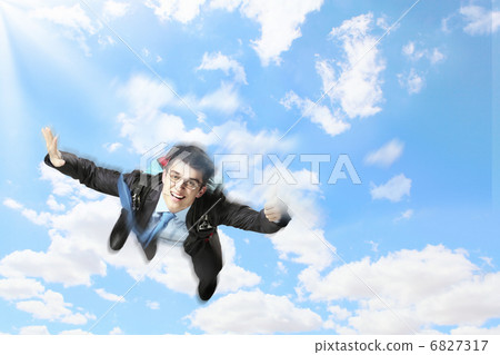Young businessman flying with parachute on back Young businessman flying with parachute on back 6827317