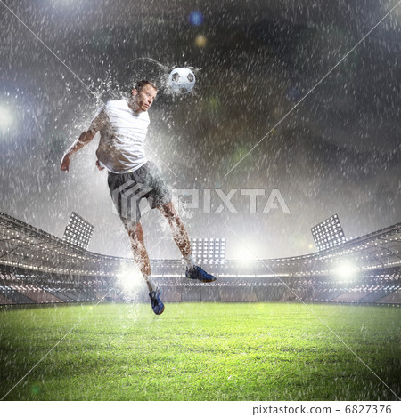 football player striking the ball football player striking the ball 6827376