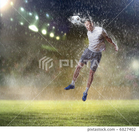 football player striking the ball football player striking the ball 6827402