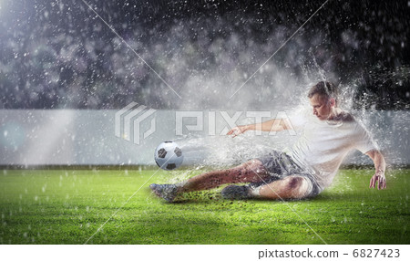 football player striking the ball football player striking the ball 6827423