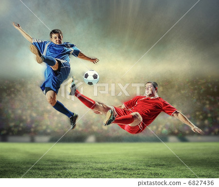 two football players striking the ball 6827436