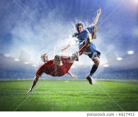 two football players striking the ball two football players striking the ball 6827451