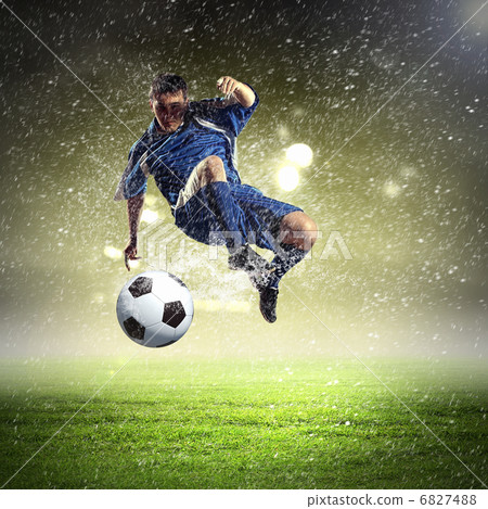 football player striking the ball football player striking the ball 6827488