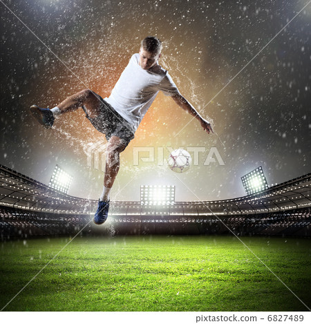 football player striking the ball football player striking the ball 6827489