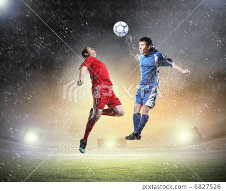 two football players striking the ball 6827526