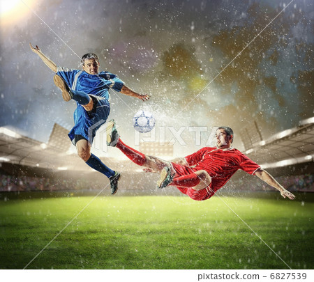 two football players striking the ball 6827539