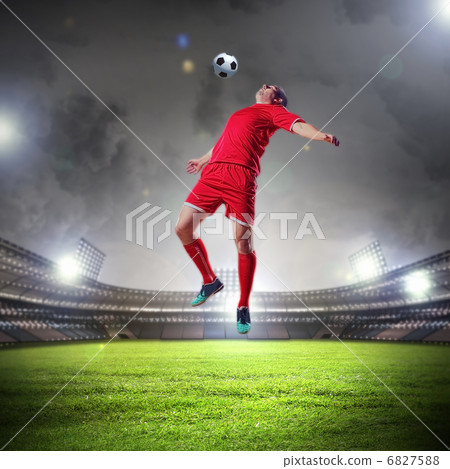 football player striking the ball football player striking the ball 6827588