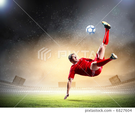 football player striking the ball football player striking the ball 6827604