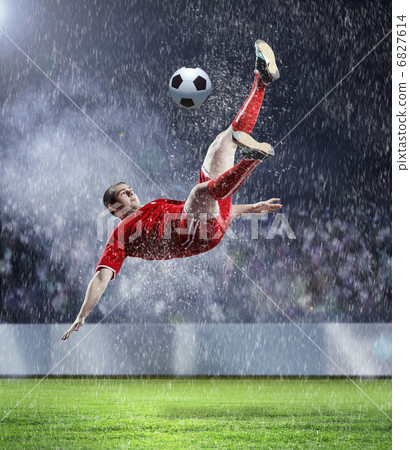 football player striking the ball football player striking the ball 6827614